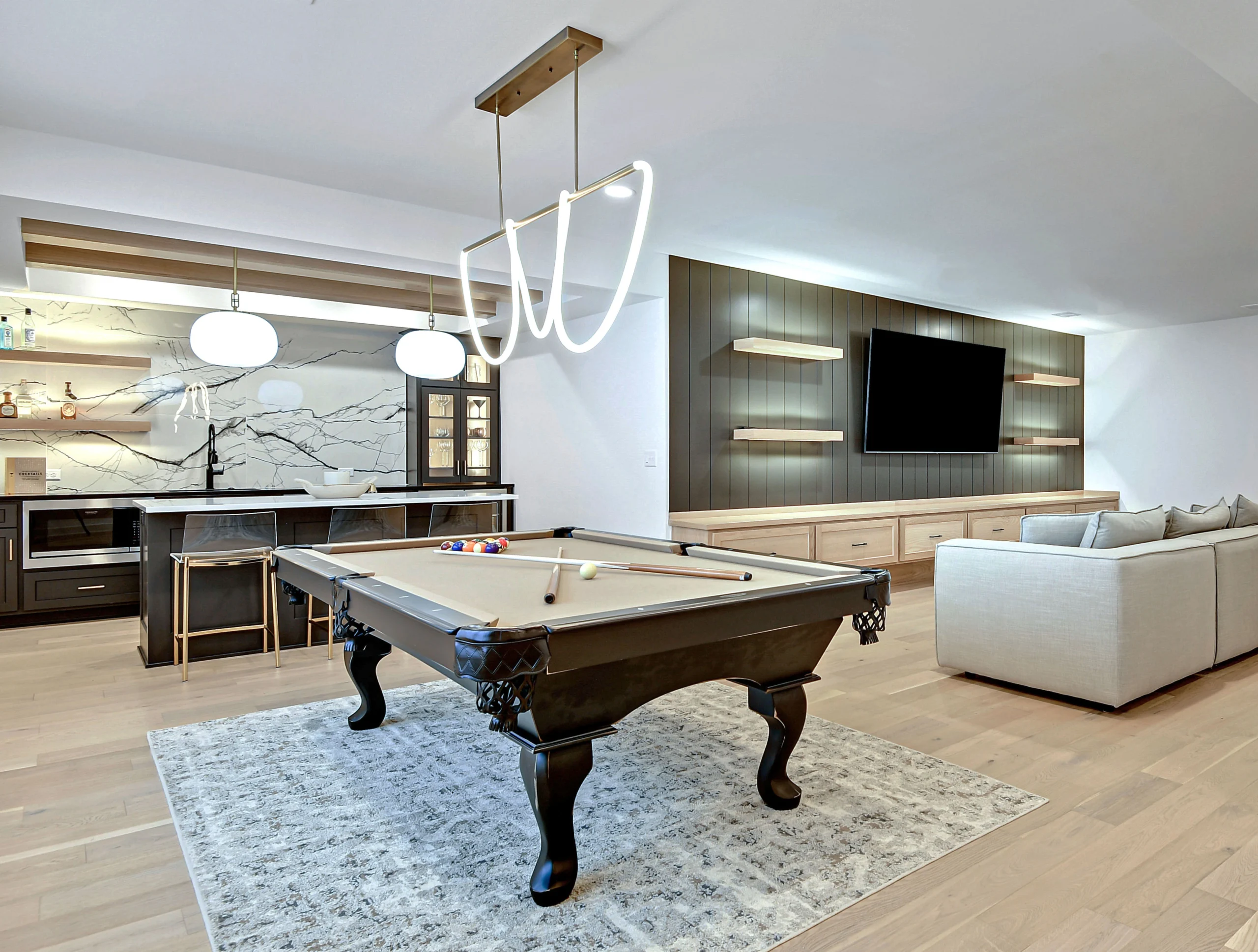 Finished basement family room with custom media wall in Overland Park