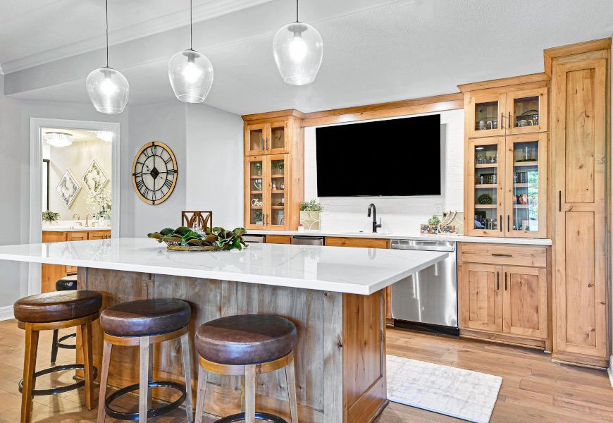 Open concept kitchen remodeling with large island, wood cabinetry, and updated lighting for everyday living