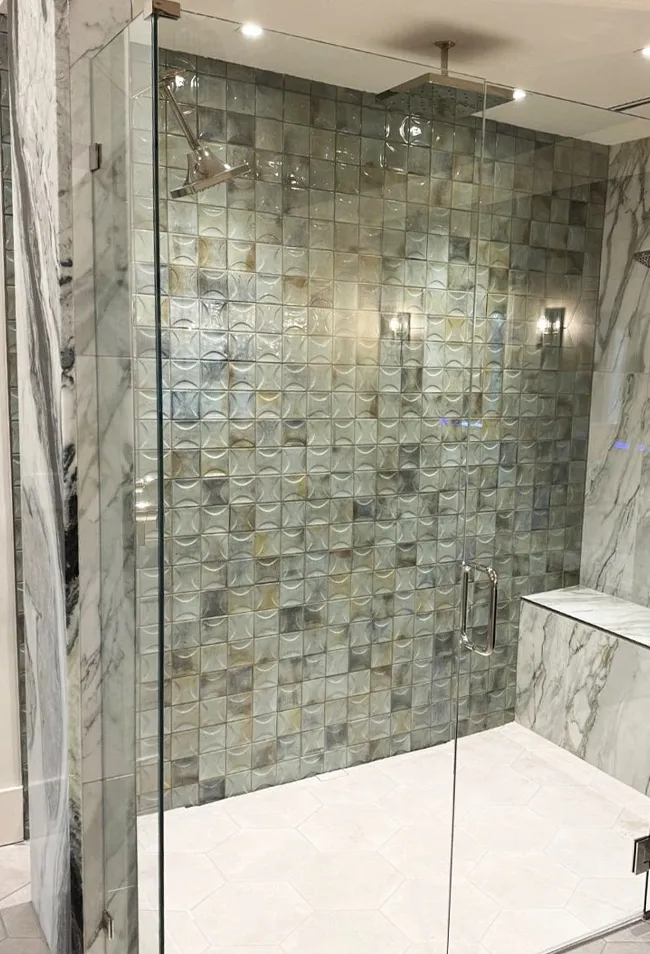 Modern bathroom remodel with walk-in shower, custom tile walls, and contemporary fixtures
