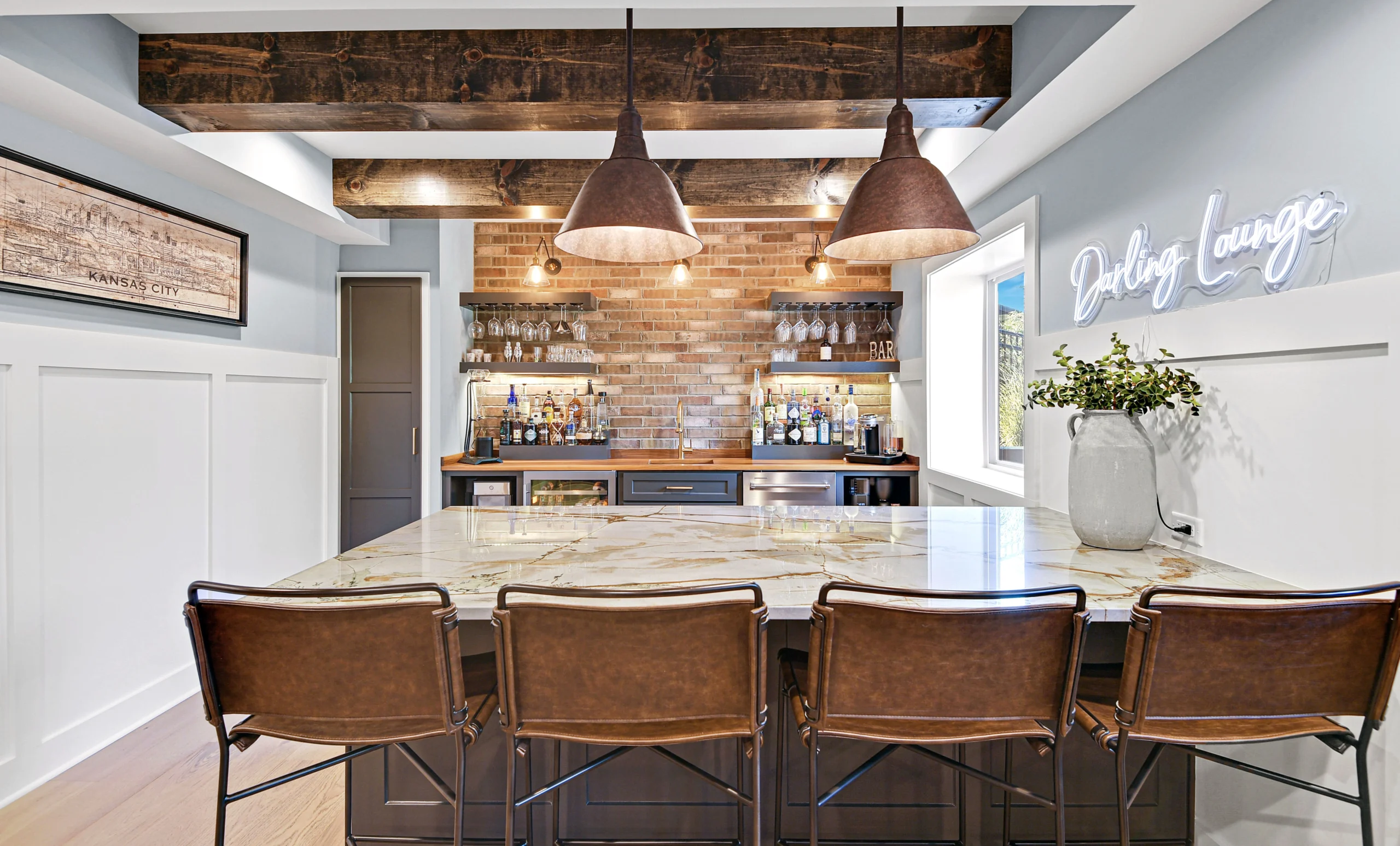 Basement bar and entertainment area in a finished basement remodel in Overland Park Kansas